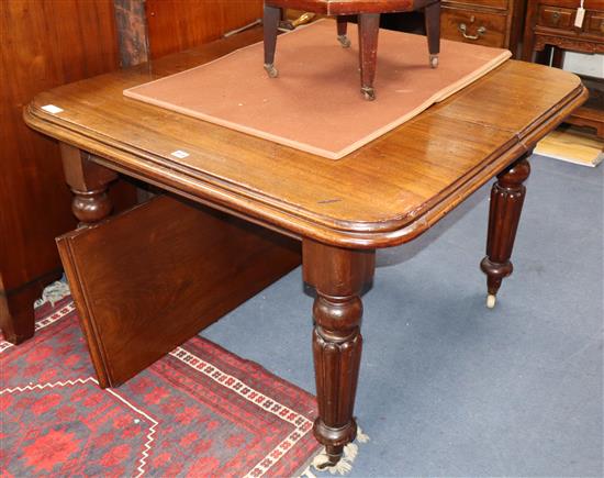 A Victorian mahogany dining table with one extra leaf and winder Length 142cm extended
